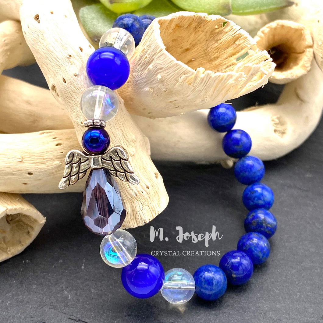Lapis Lezuli is a tremendously spiritual stone; enhanced with an angel charm, you're sure to feel the connection from this bracelet.