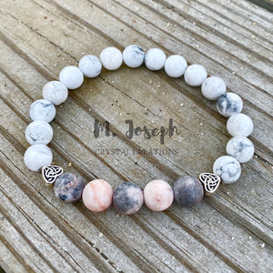 The vibrations of this howlite and jasper bracelet both heals and connects us to the earth's energy.