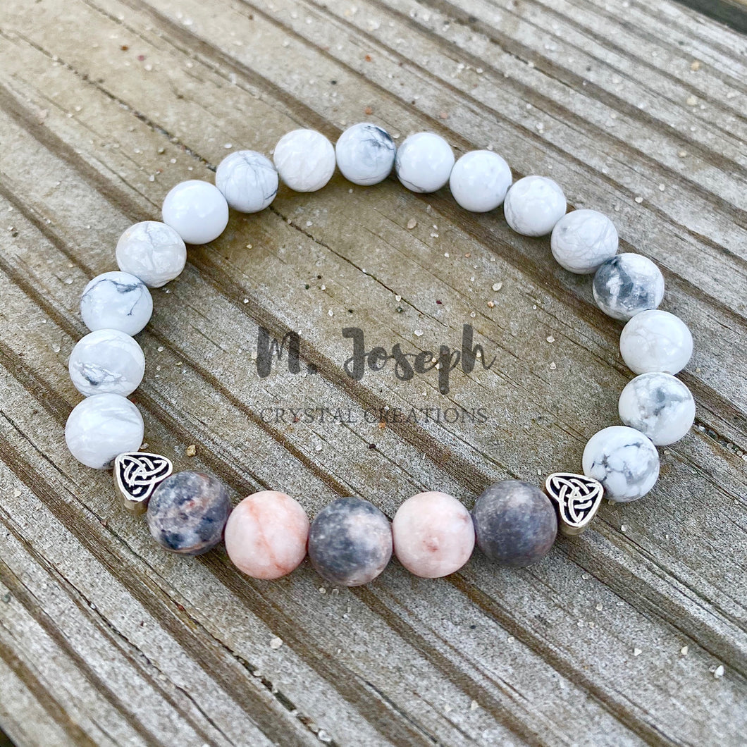 The vibrations of this howlite and jasper bracelet both heals and connects us to the earth's energy.